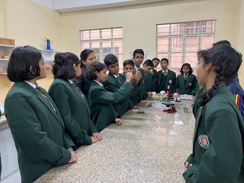 Students of class 4 utilizing modern computer science facilities